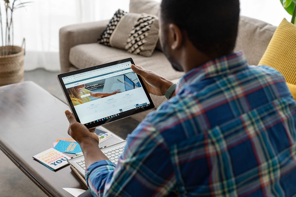 Man using LinkedIn on a tablet